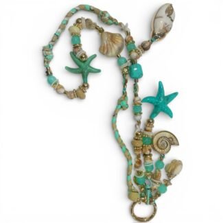 Sautoir bohème chic Marée Dorée beige avec étoile de mer, coquillages et perles décoratives