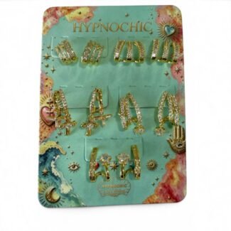 Plaquette de cinq paires de boucles d’oreilles dorées Éclats Divins avec croix et cristaux HYPNOCHIC